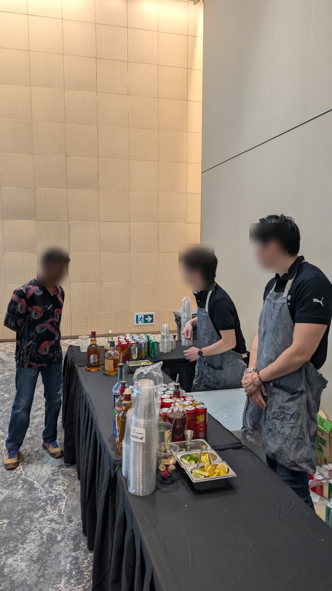 Corporate event live bartending station in Singapore with spirits, mixers and fresh garnishes